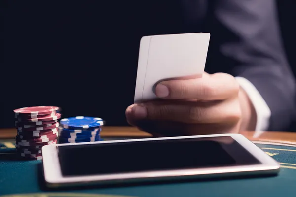 SPINARA Login — Instantly access your secure account A confident dealer surrounded by casino chips inviting players to access their SPINARA account, reflecting quick and easy login options.